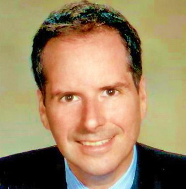 Frederico Ziotto Smiling man in a professional setting with short, dark hair and a light-colored shirt.
