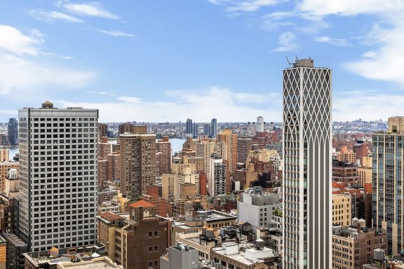 Panoramic view Panoramic view of a city skyline with tall buildings and blue sky.