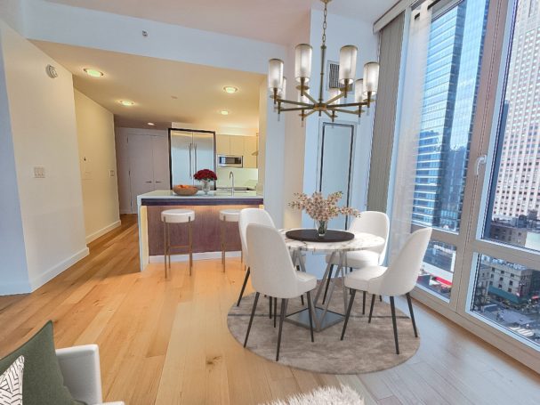 Open Kitchen and dinning Modern dining area with a round table, four chairs, and large windows.