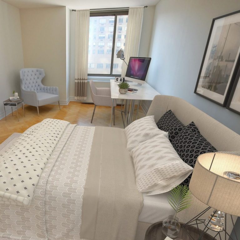 Master bedroom Large bedroom with a light blue wall, a bed, desk, chair, and large window.