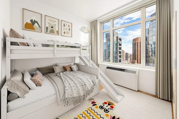 Second Bedroom Cozy children's bedroom featuring a bunk bed, slide, and large window with city views.
